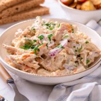 Rotisserie chicken salad in a white bowl.