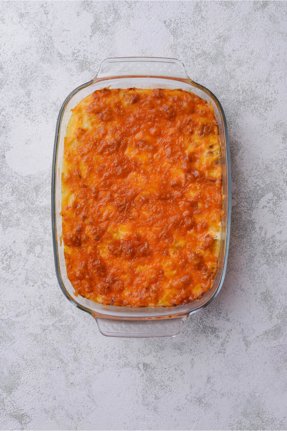 A casserole topped with melted cheese.