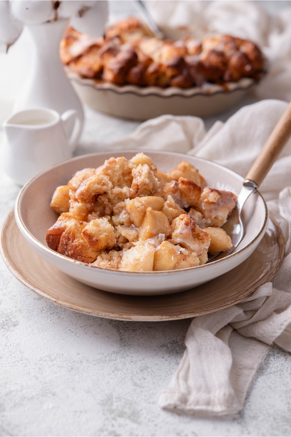 A bowl with Cinnamon Rolls With Apple Pie Filling.