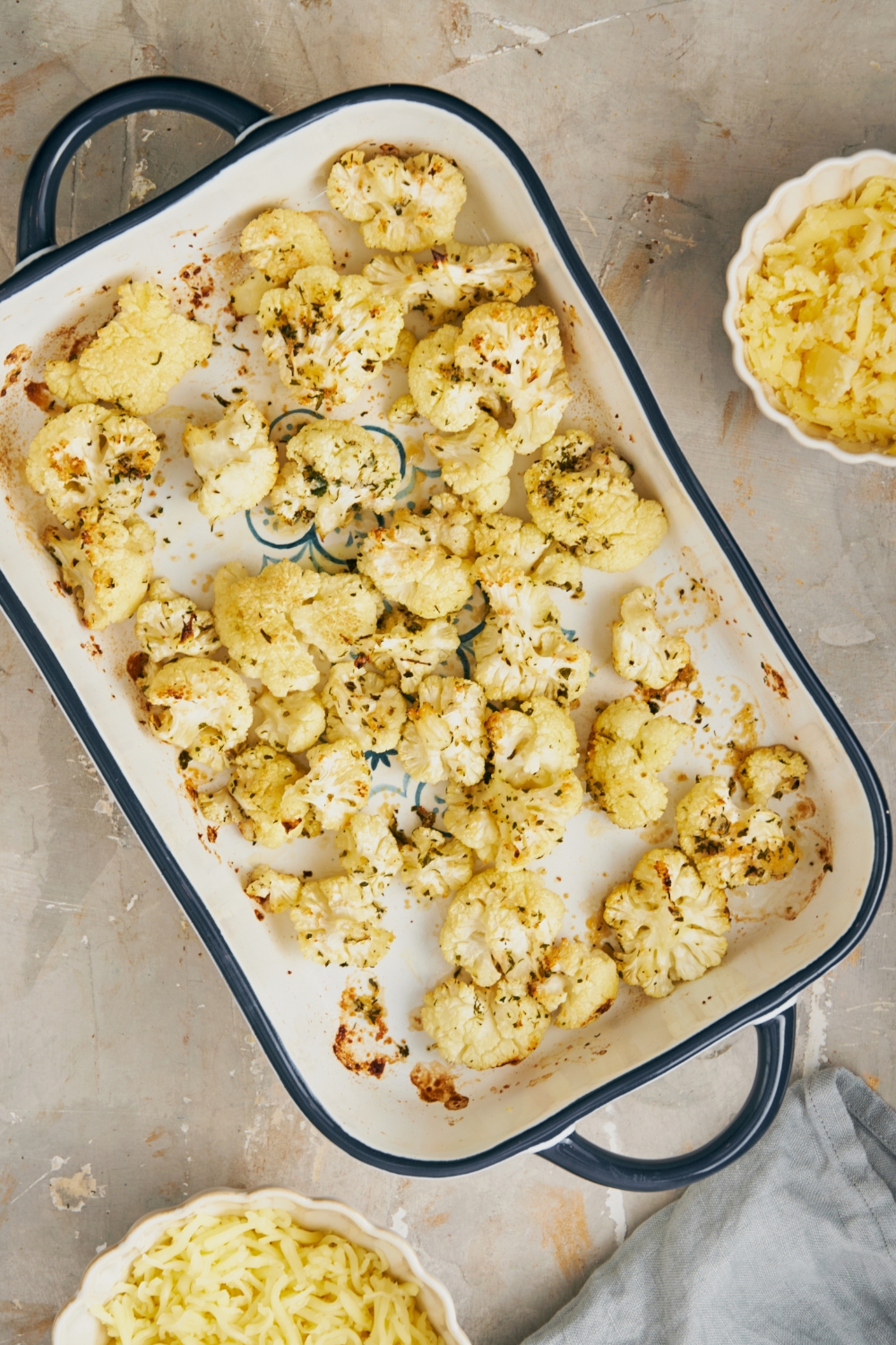A casserole dish with a layer of cauliflower.