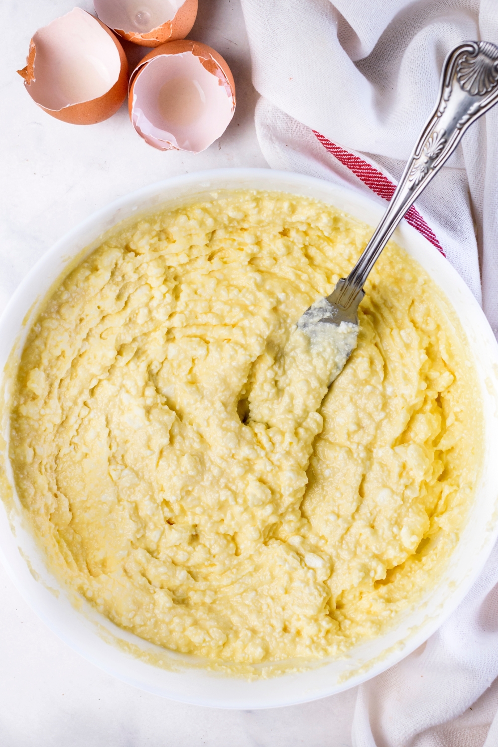 A mixing bowl with baked ricotta mixture.
