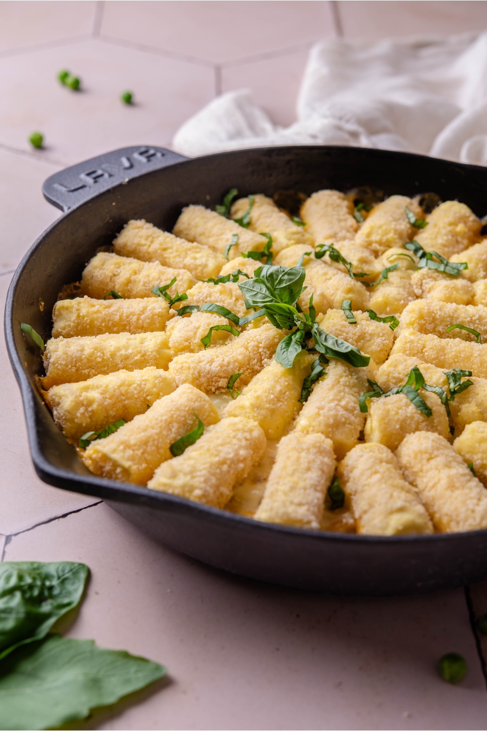A cast iron skillet with vegetarian tater tot casserole.