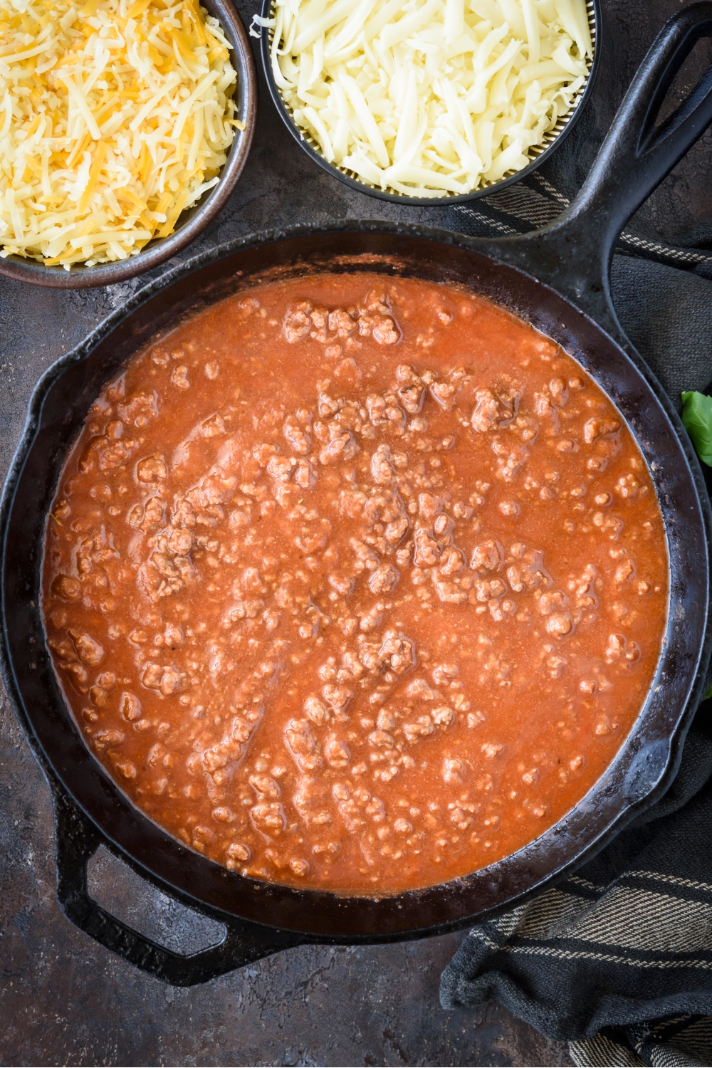 Ground beef in tomato soup in a skillet.