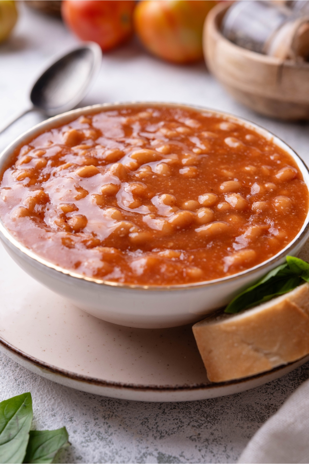 Baked beans in a white bowl.