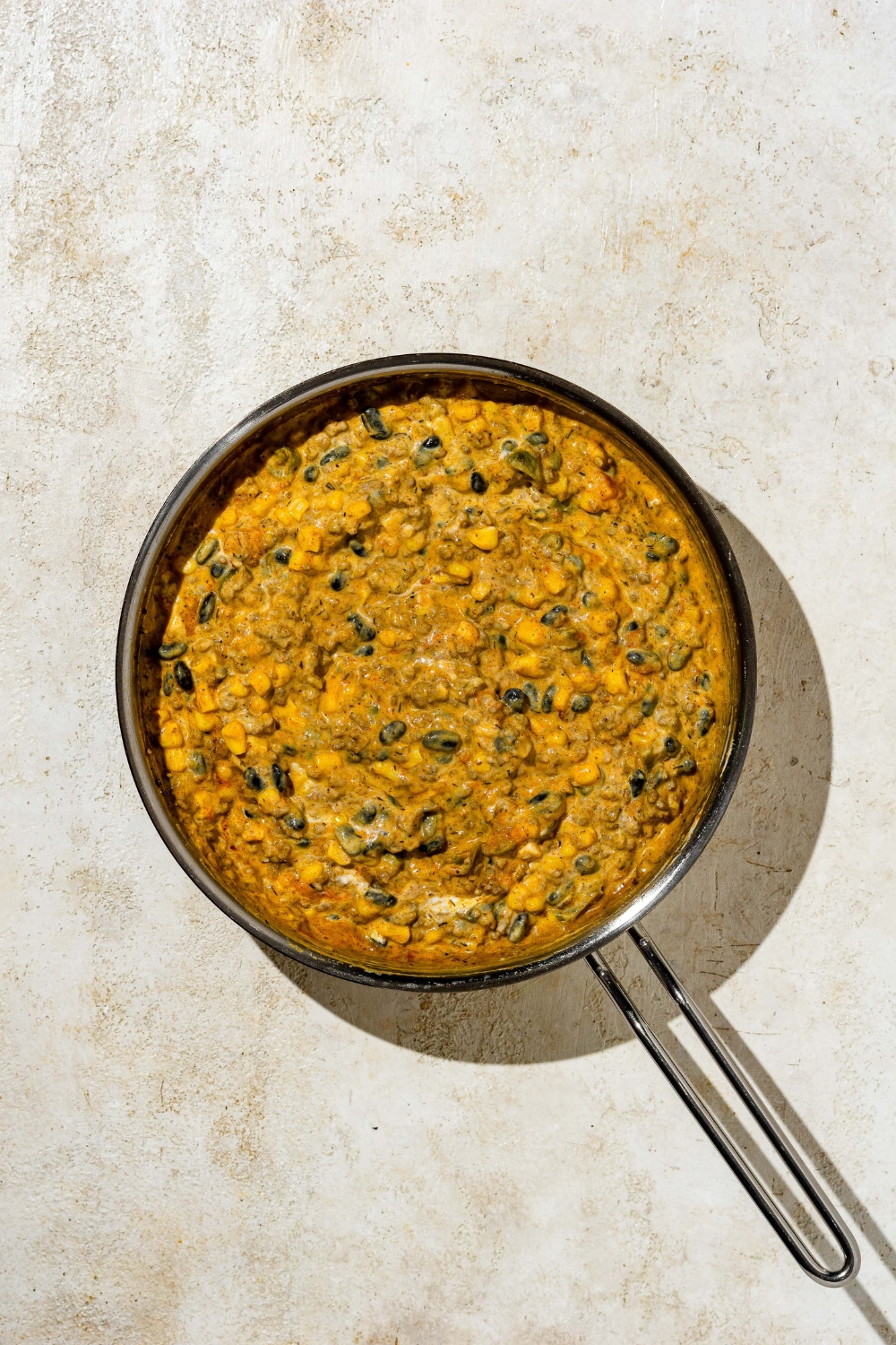 Dorito taco casserole filling in a skillet.