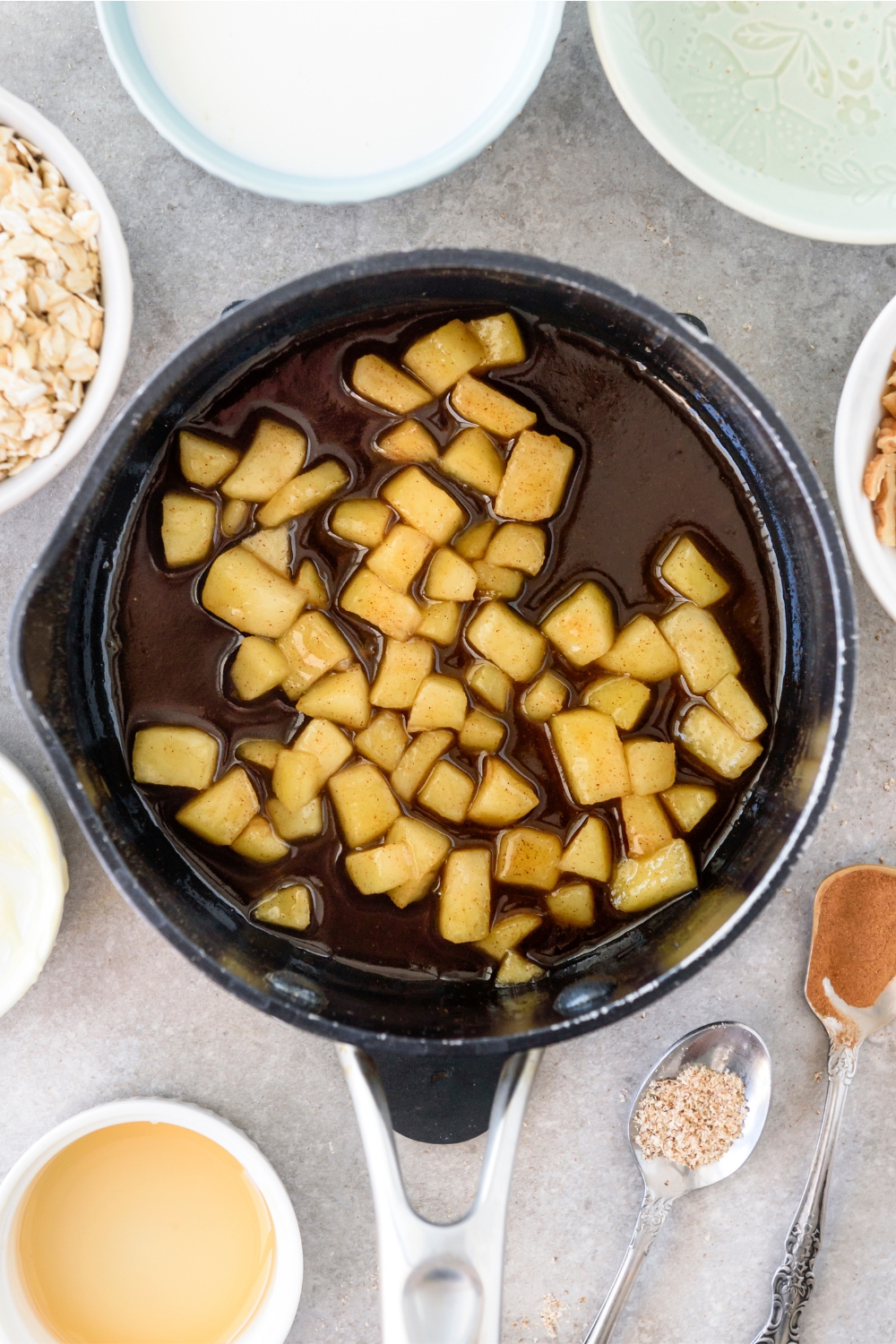 A pot filled with diced apples in honey.