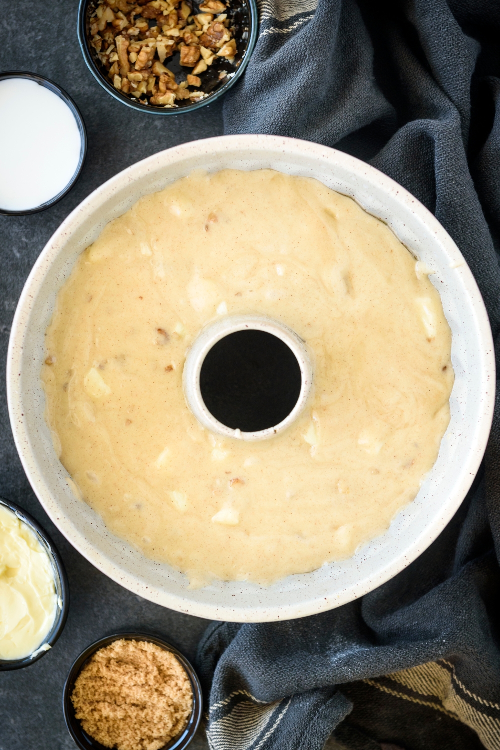 A bundt cake pan with cake batter in it.