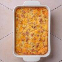 A casserole dish with baked hash brown casserole.