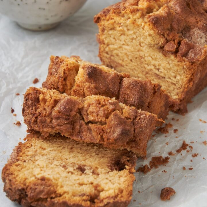 three slices of baked cinnamon bread on a white plate
