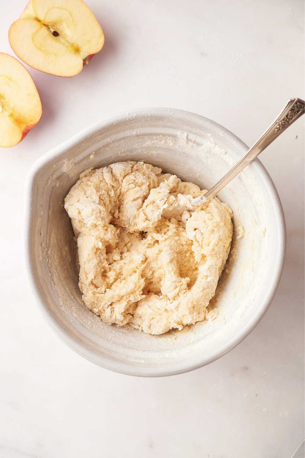 A mixing bowl with the cobbler topping mixed.