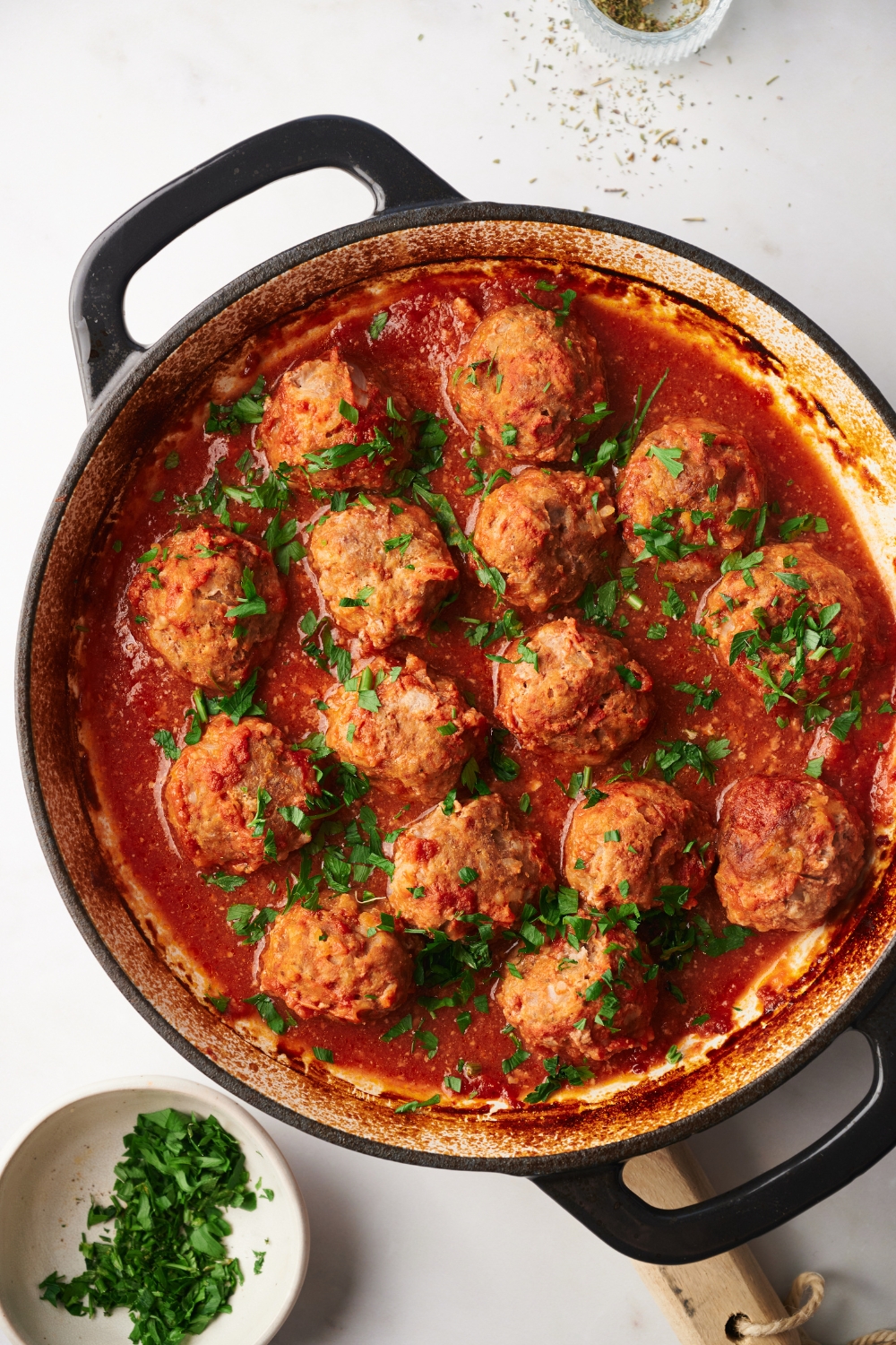 a pot of cooked porcupine meatballs in a tomato sauce