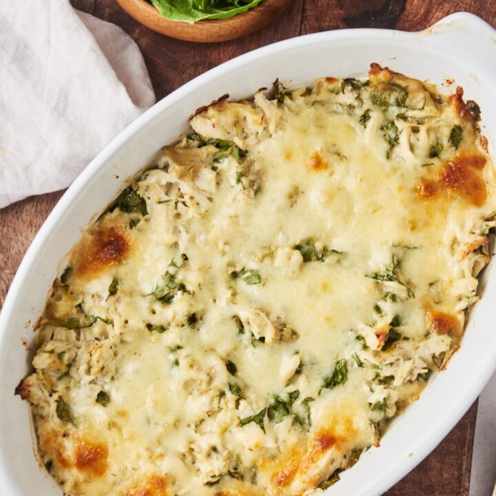 A baking dish filled with casserole covered in melted cheese.