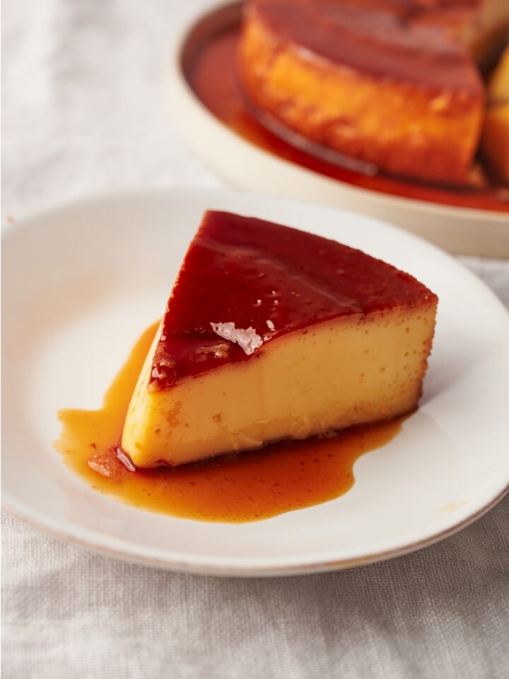 A small plate with a slice of flan.