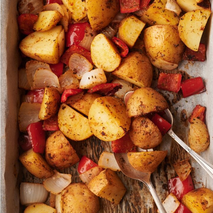 A baking sheet with uncooked Mexican potatoes.