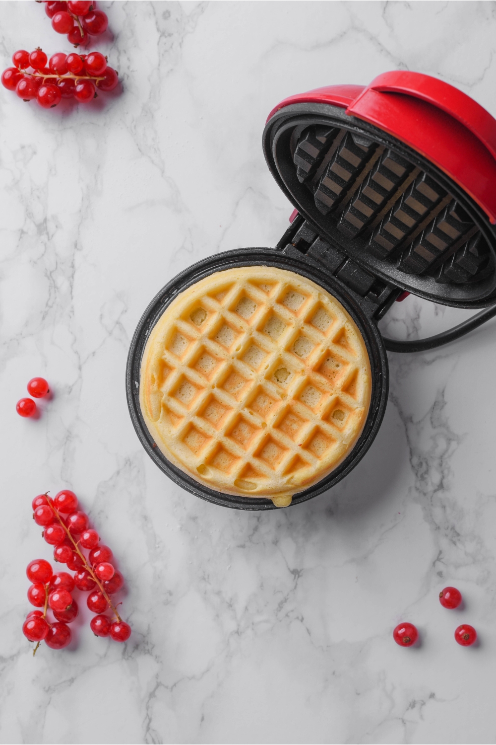 A mini waffle maker cooking the waffles.