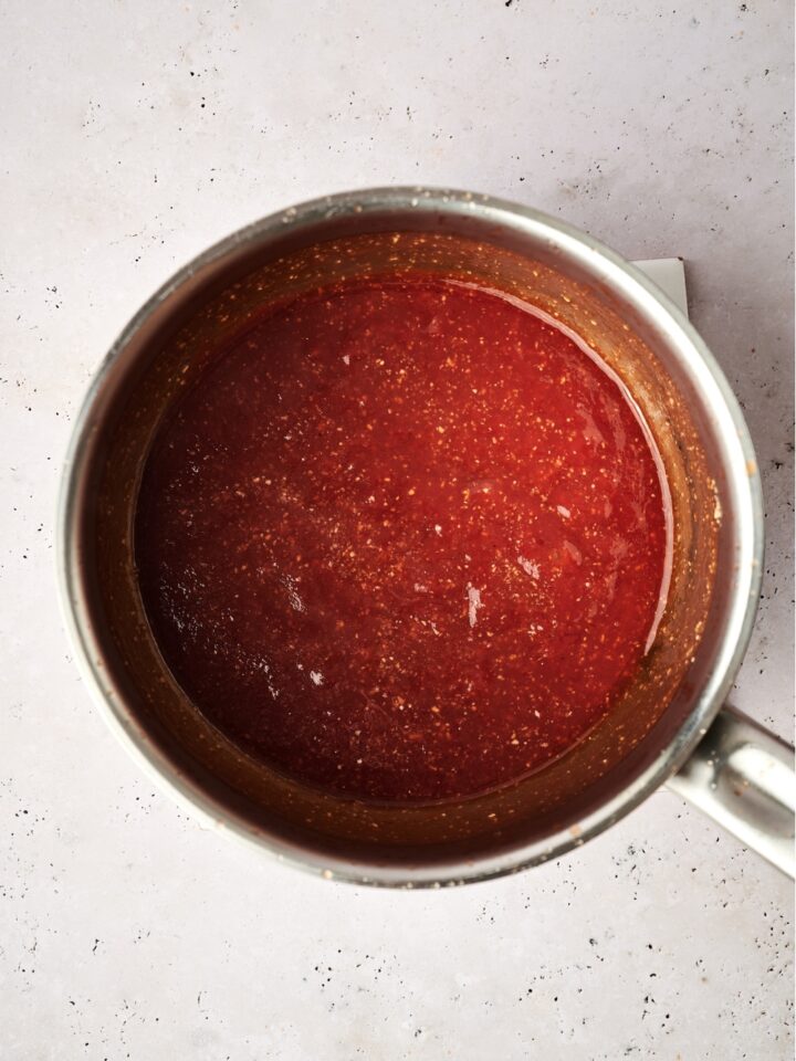 A pot with the sauce ingredients combined and cooked.