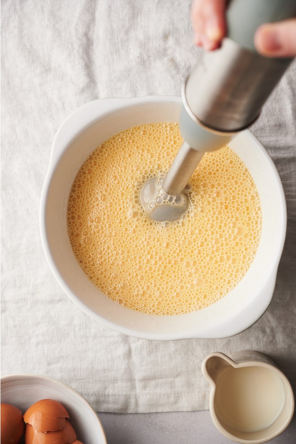 A mixing bowl with the flan mixture blended together.