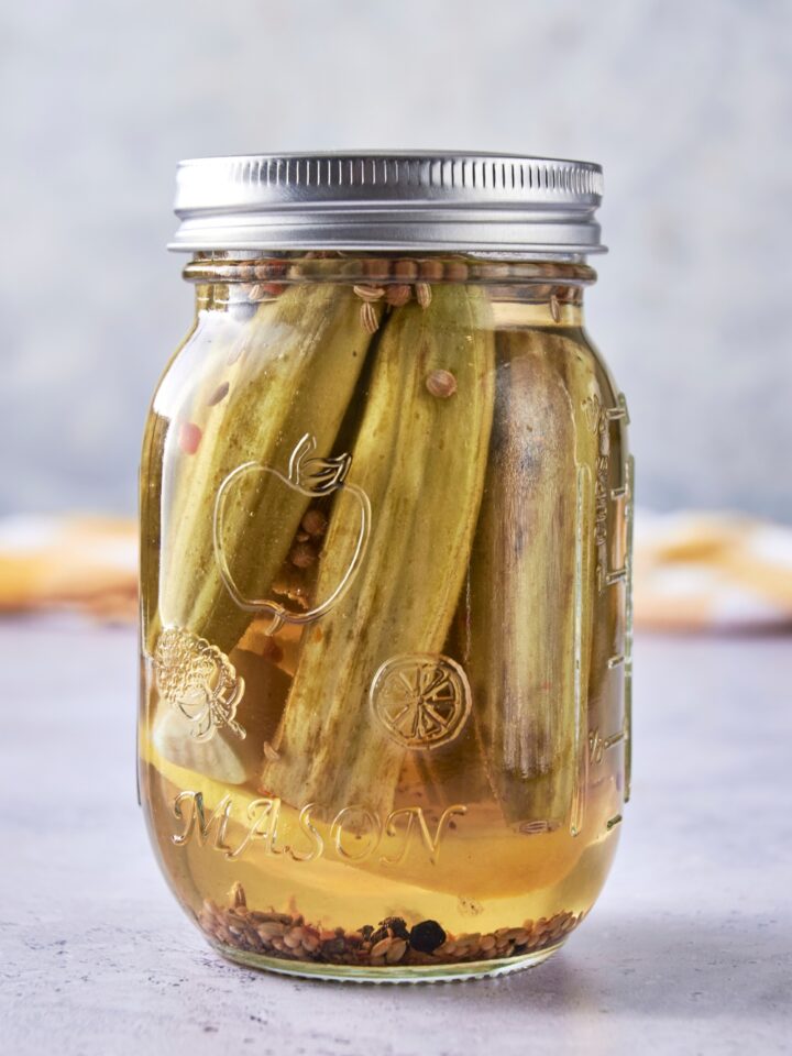 A jar with pickled okra.