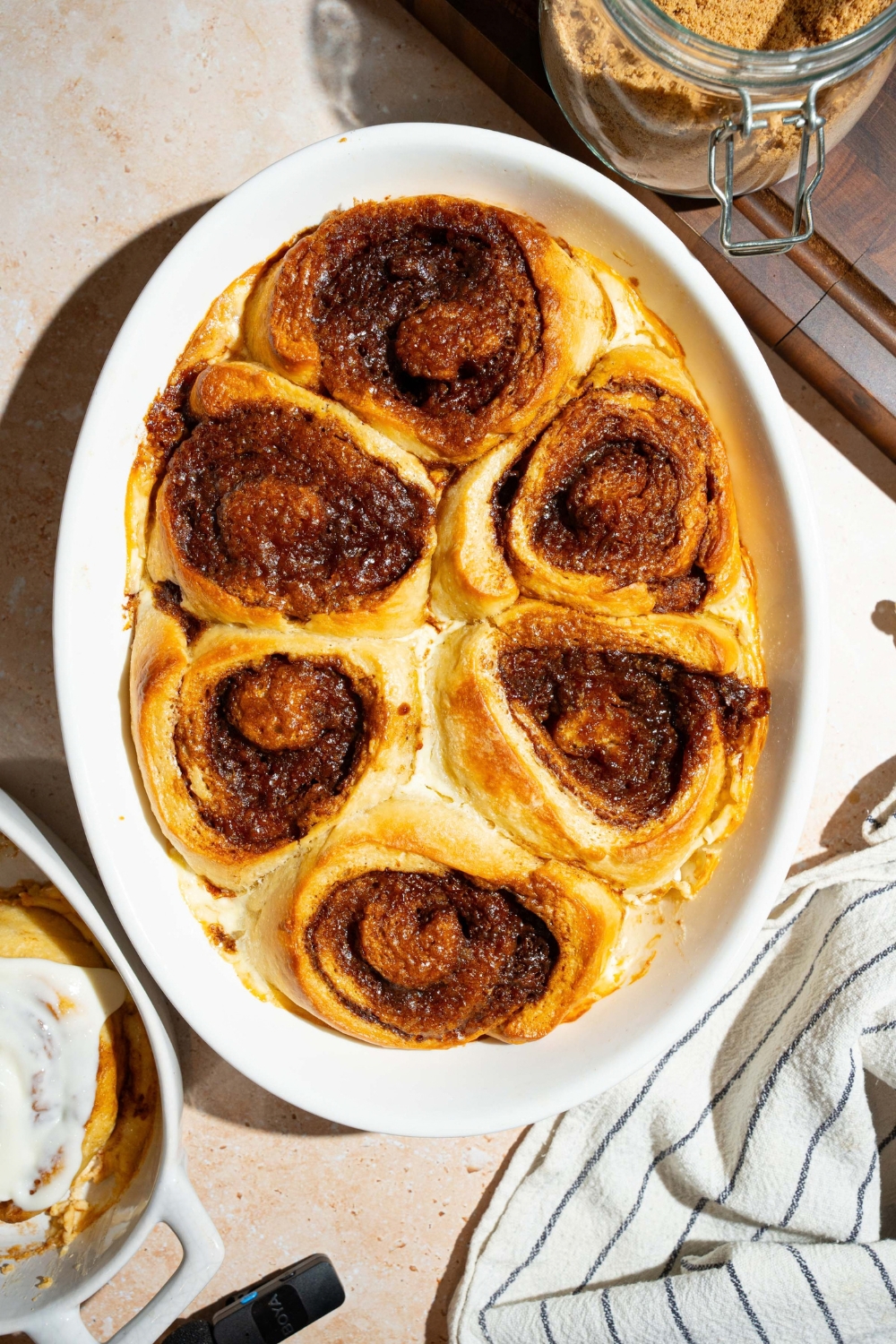 A bunch of baked heavy cream cinnamon rolls.