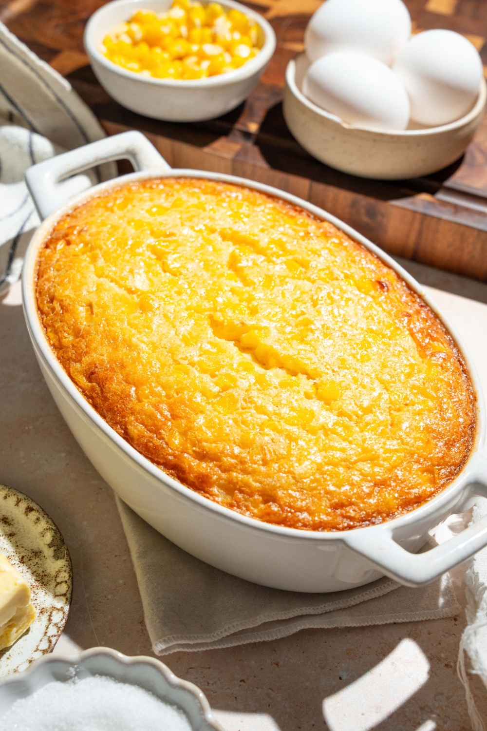 A casserole dish that is filled with corn casserole.