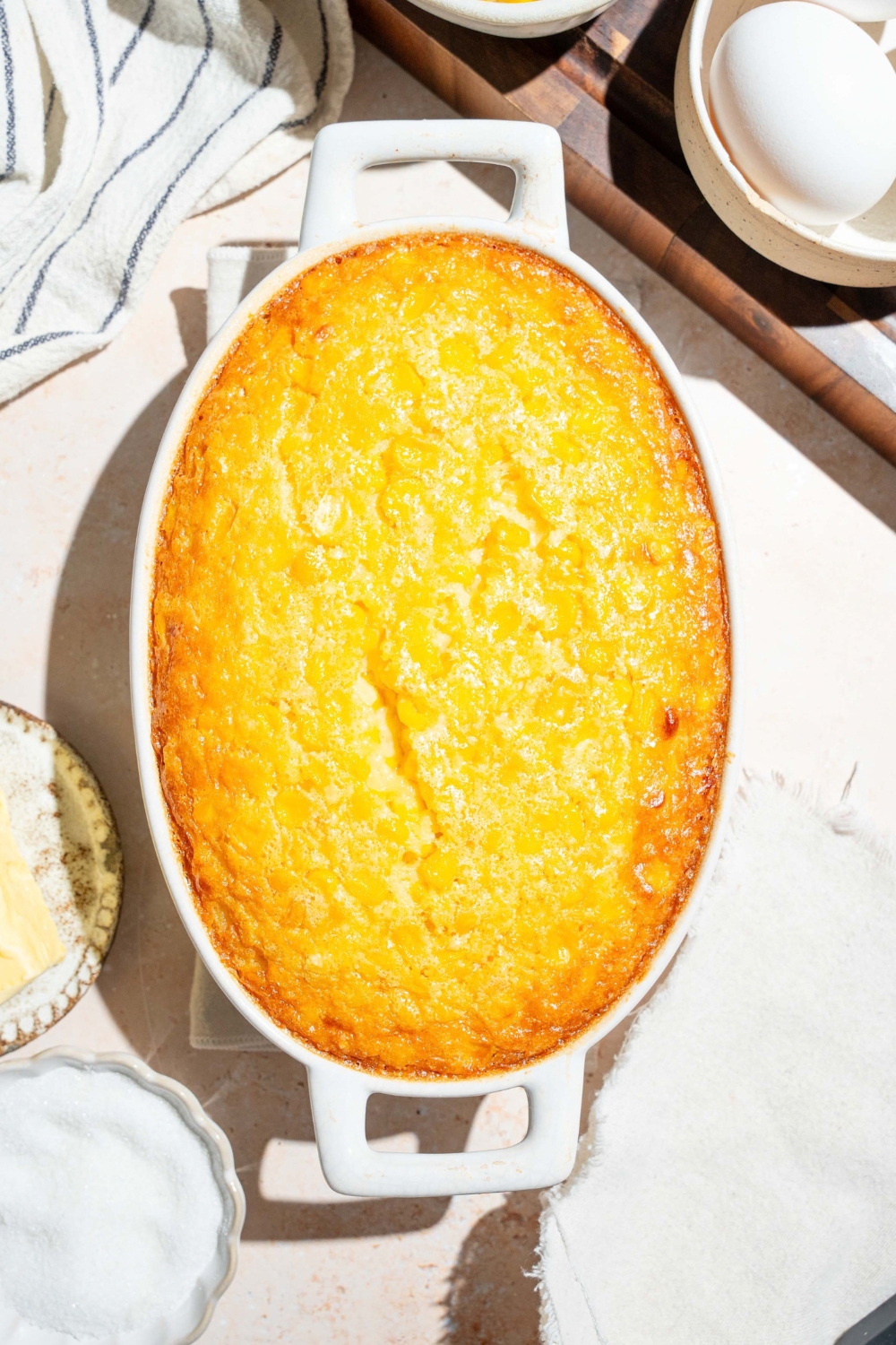 A baked corn casserole in a casserole dish.