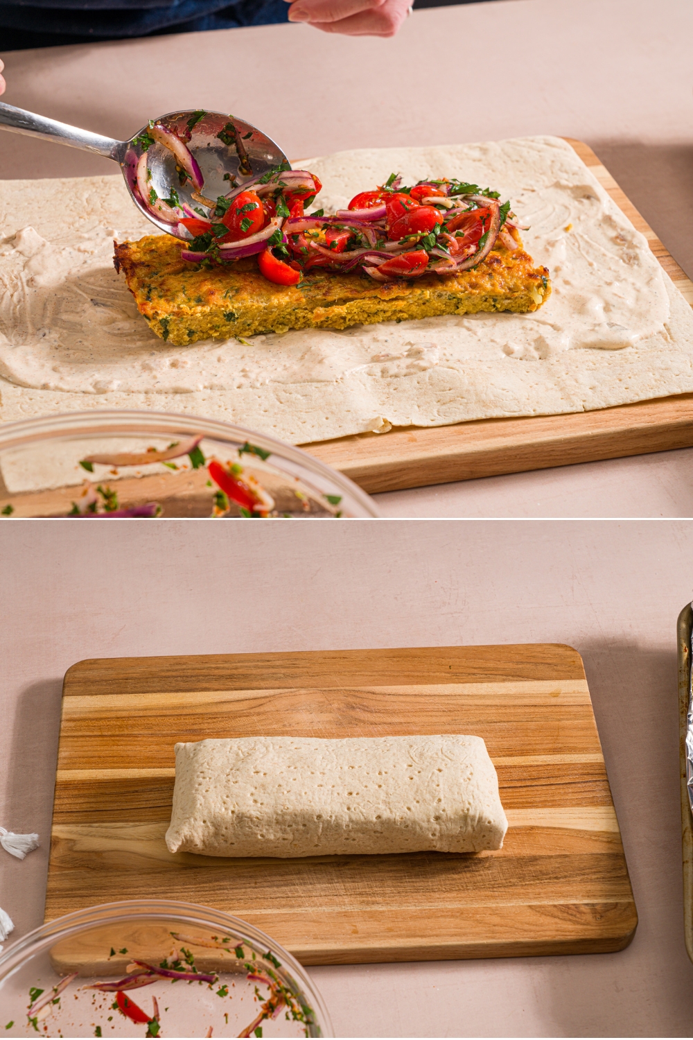 Two photos of a baking sheet kefta chicken wrap being assembled on a wooden board. The first photo shows an open wrap layered with garlic mayo, chicken kefta, and a spoon layering tomato salad over the chicken. The second photo shows the chicken kefta wrapped on the board.