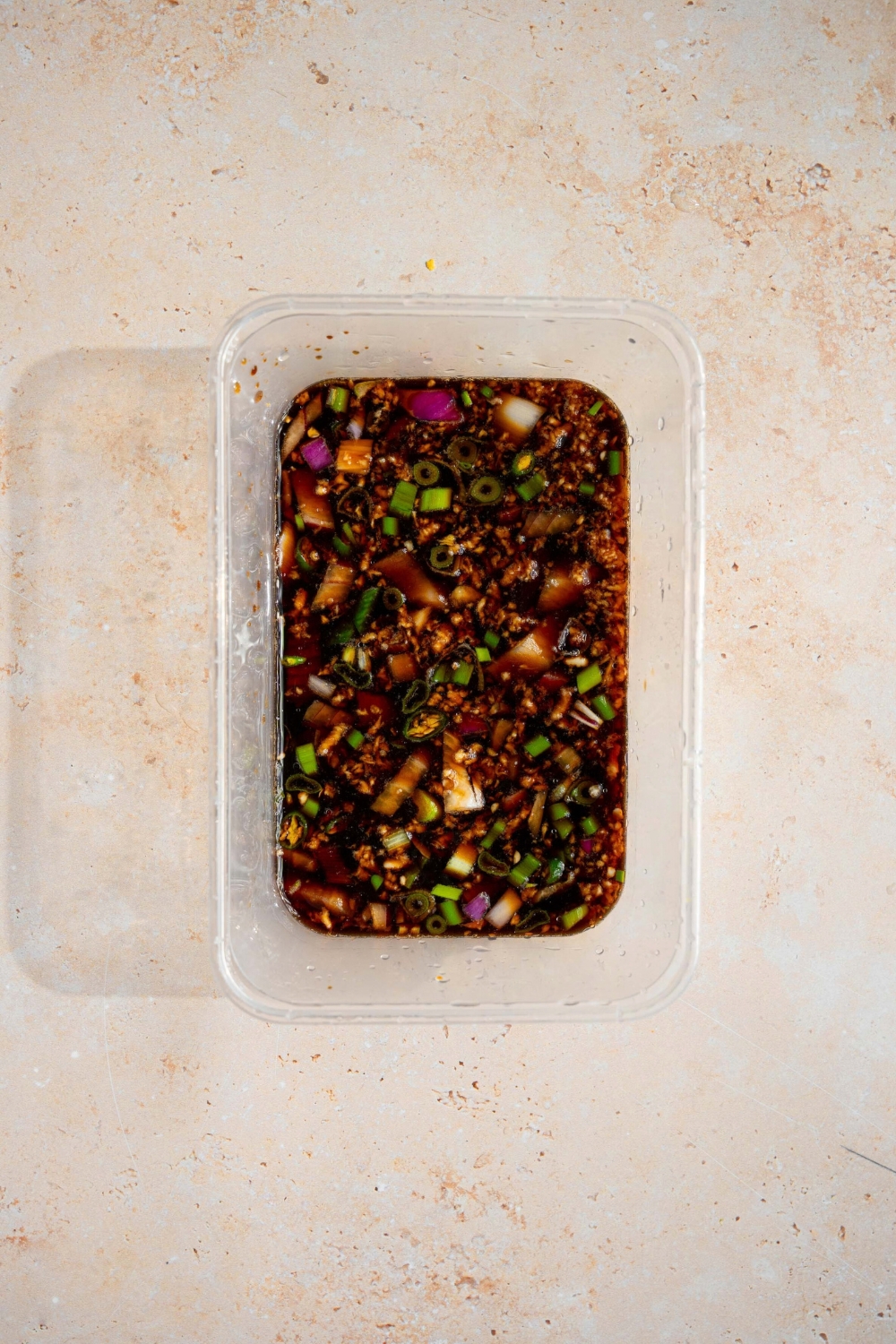 A tub of a soy sauce marinade for Korean marinated eggs.