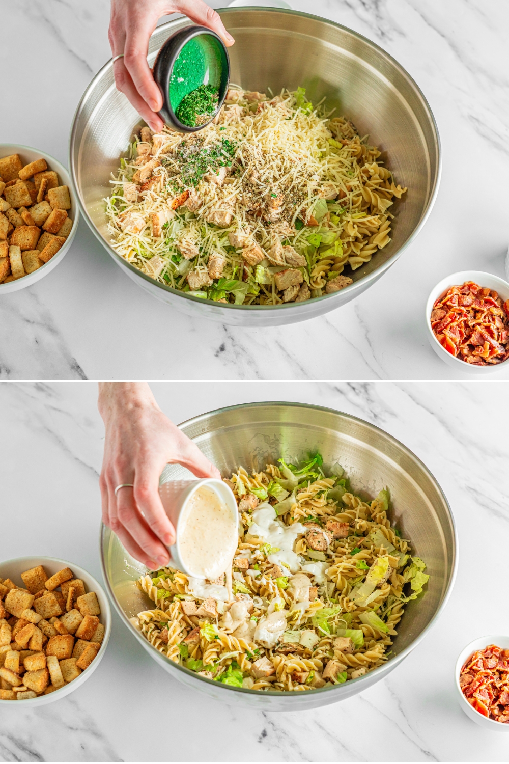 Two photos of a large bowl with ingredients being added to make chicken caesar pasta salad. The first photo shows a bowl with shredded lettuce, pasta, and chicken with a bowl bowl of seasonings being added to the mixture. The second photo shows a small bowl of caesar dressing being added to the bowl. The bowl is on a marble counter.