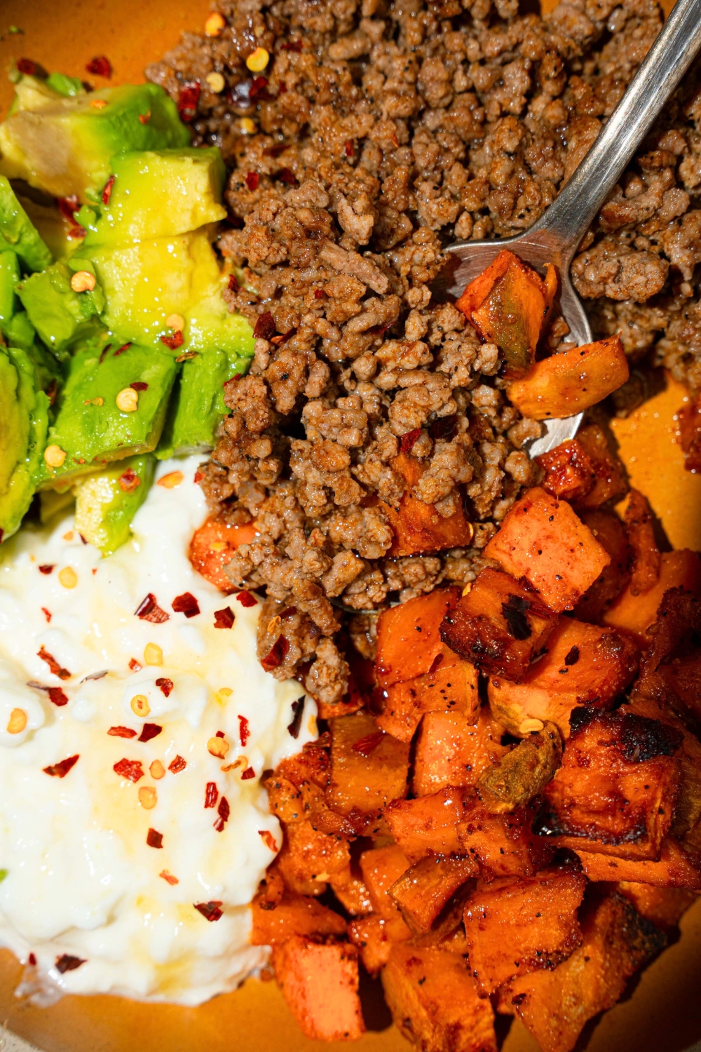 Diced roasted sweet potatoes, ground beef, cottage cheese, and avocado.