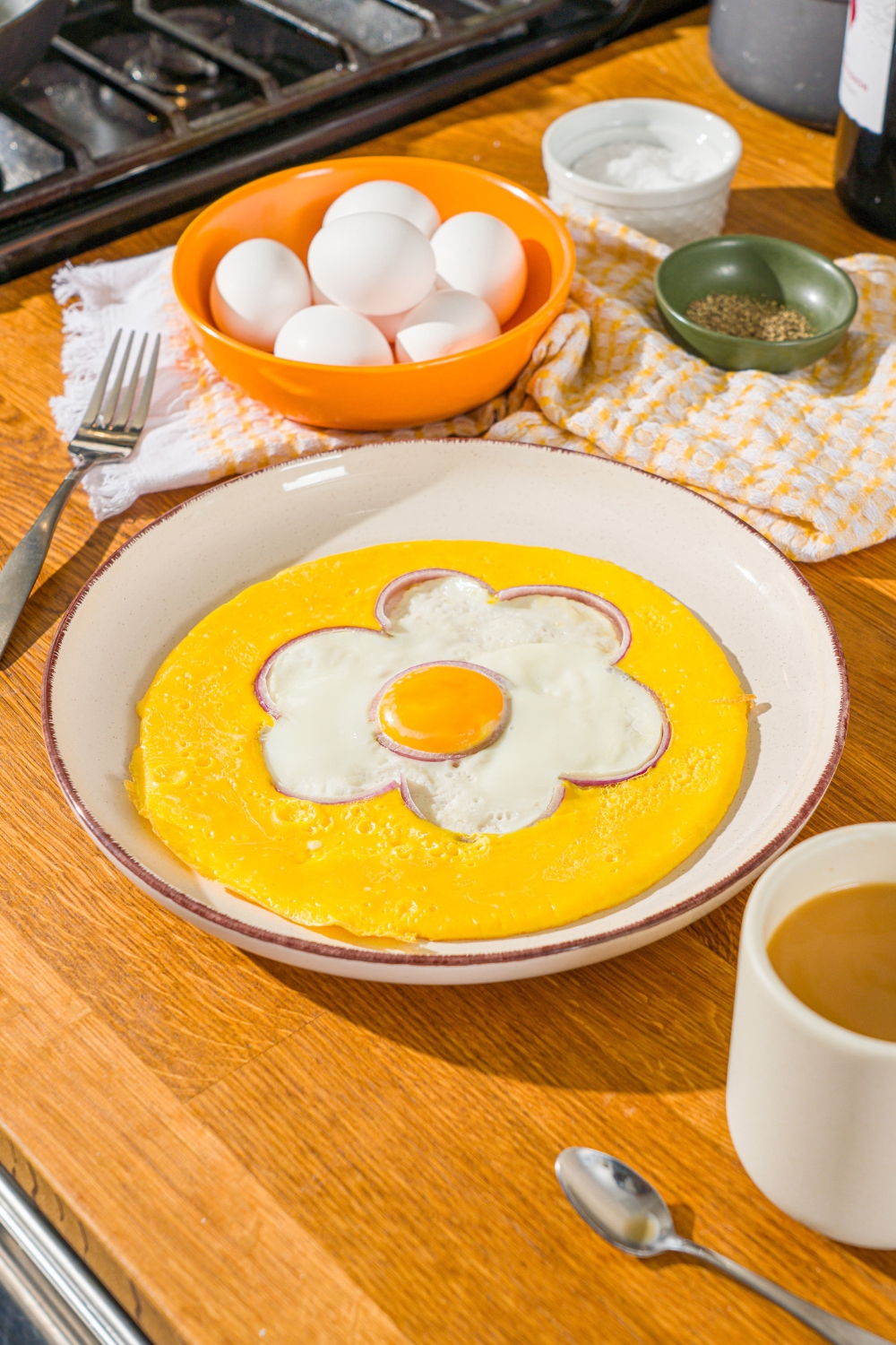 An egg flower omelette on a white plate.