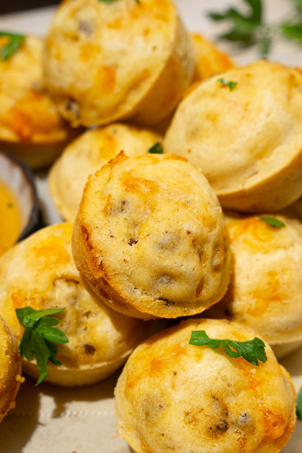 A pile of McGriddle muffins garnished with fresh parsley.