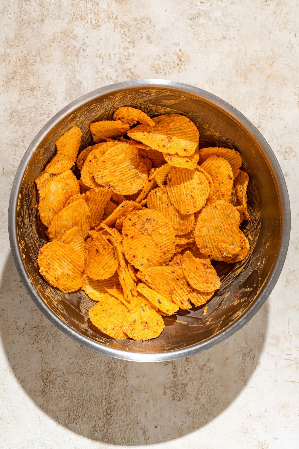 A bunch of creamy Peri peri lays in a metal bowl.