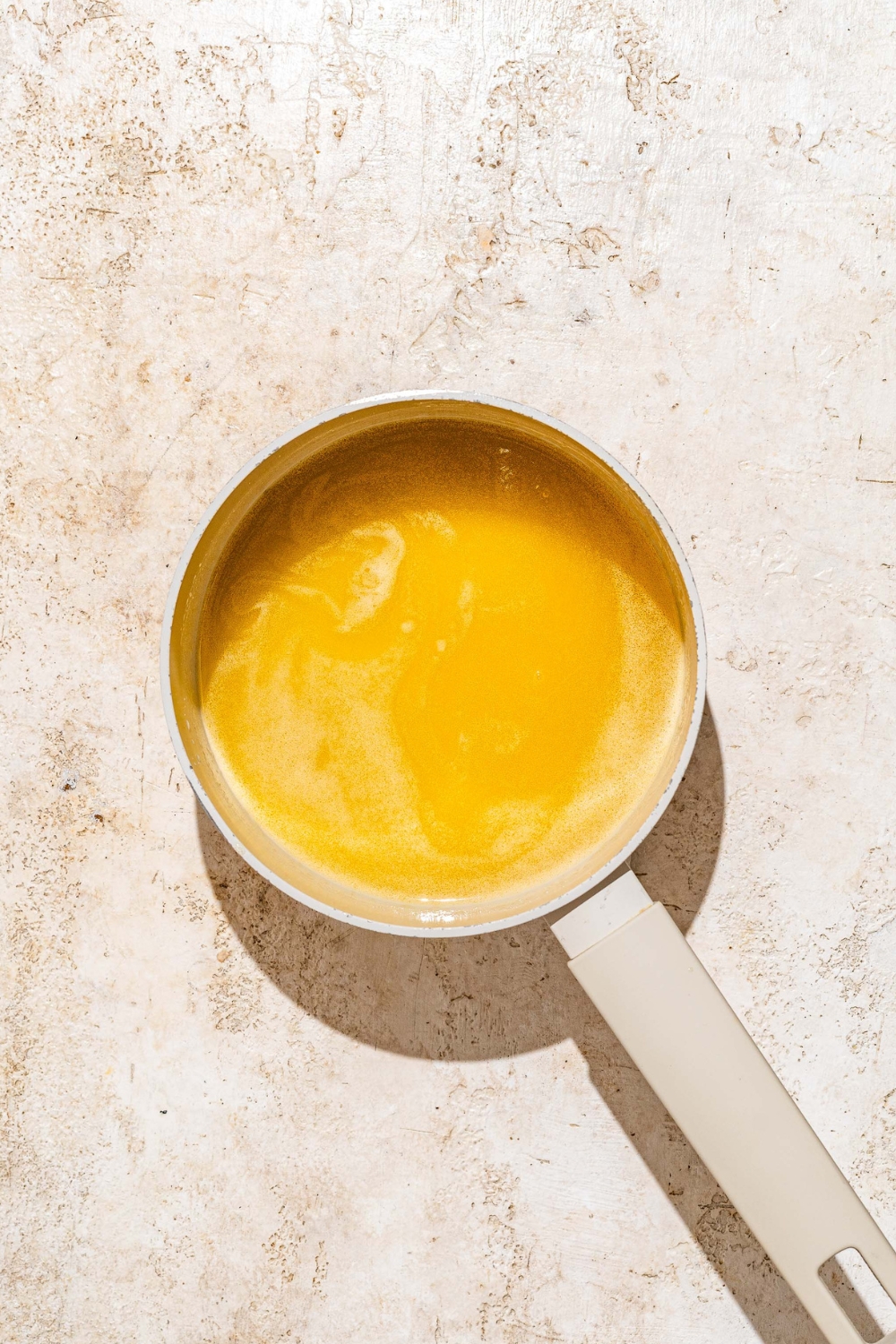 A mixture of honey butter in a pot.