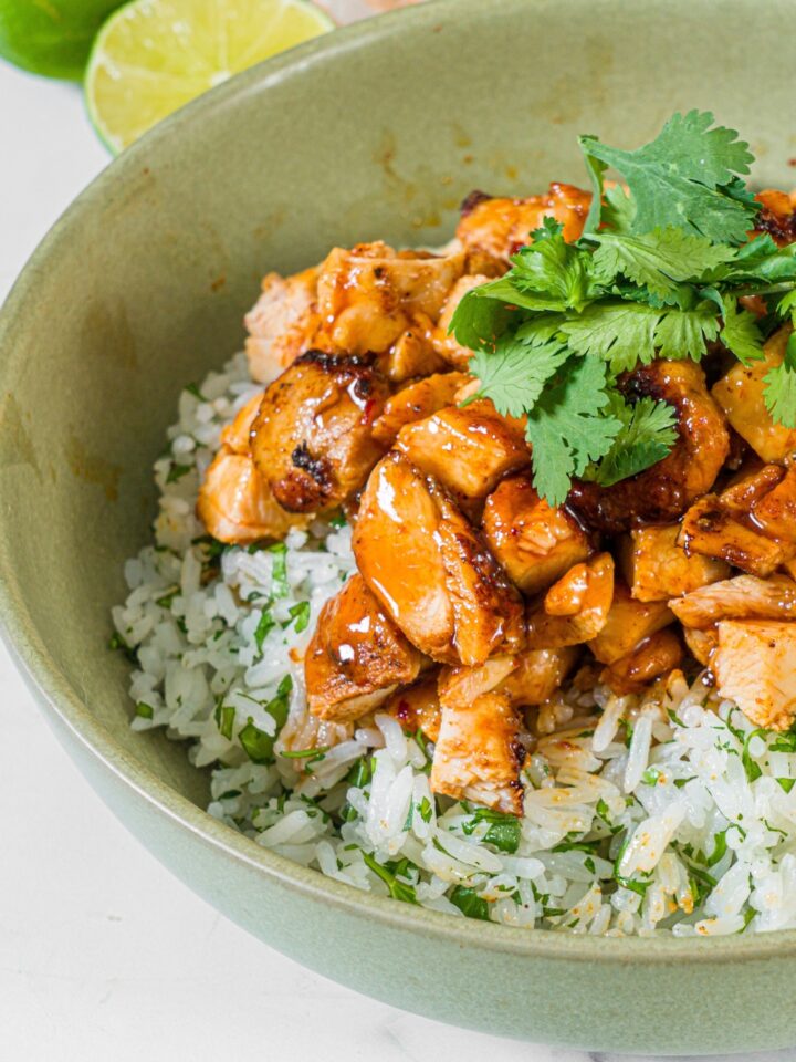 Chipotle honey chicken in a bowl with cilantro lime rice.
