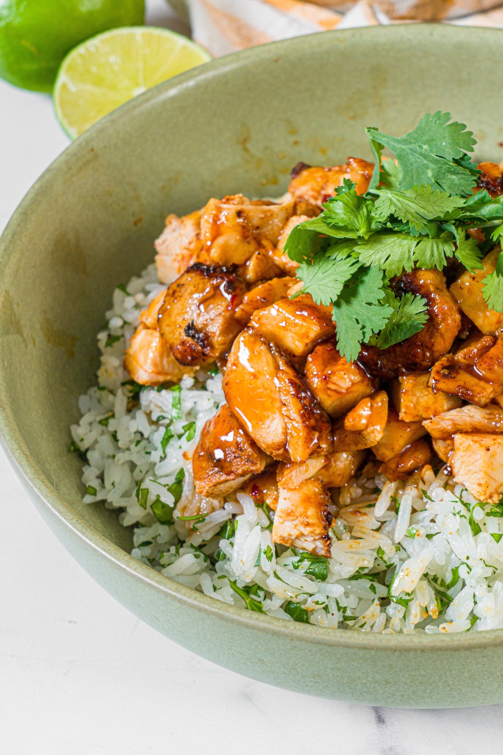 Chipotle honey chicken in a bowl with cilantro lime rice.