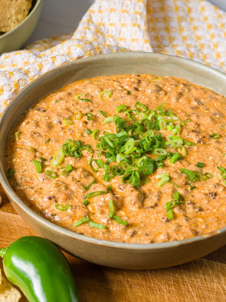 A bowl with high protein taco dip in it.